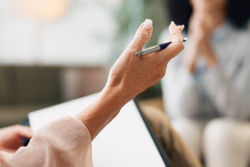 Psychology, therapist and patient or counseling with hands in consultation for mental health support and therapy
