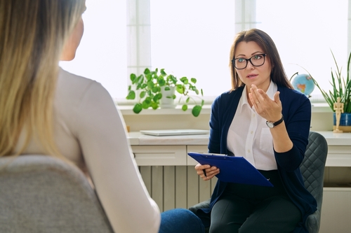 Female psychotherapist, psychologist working with young woman
